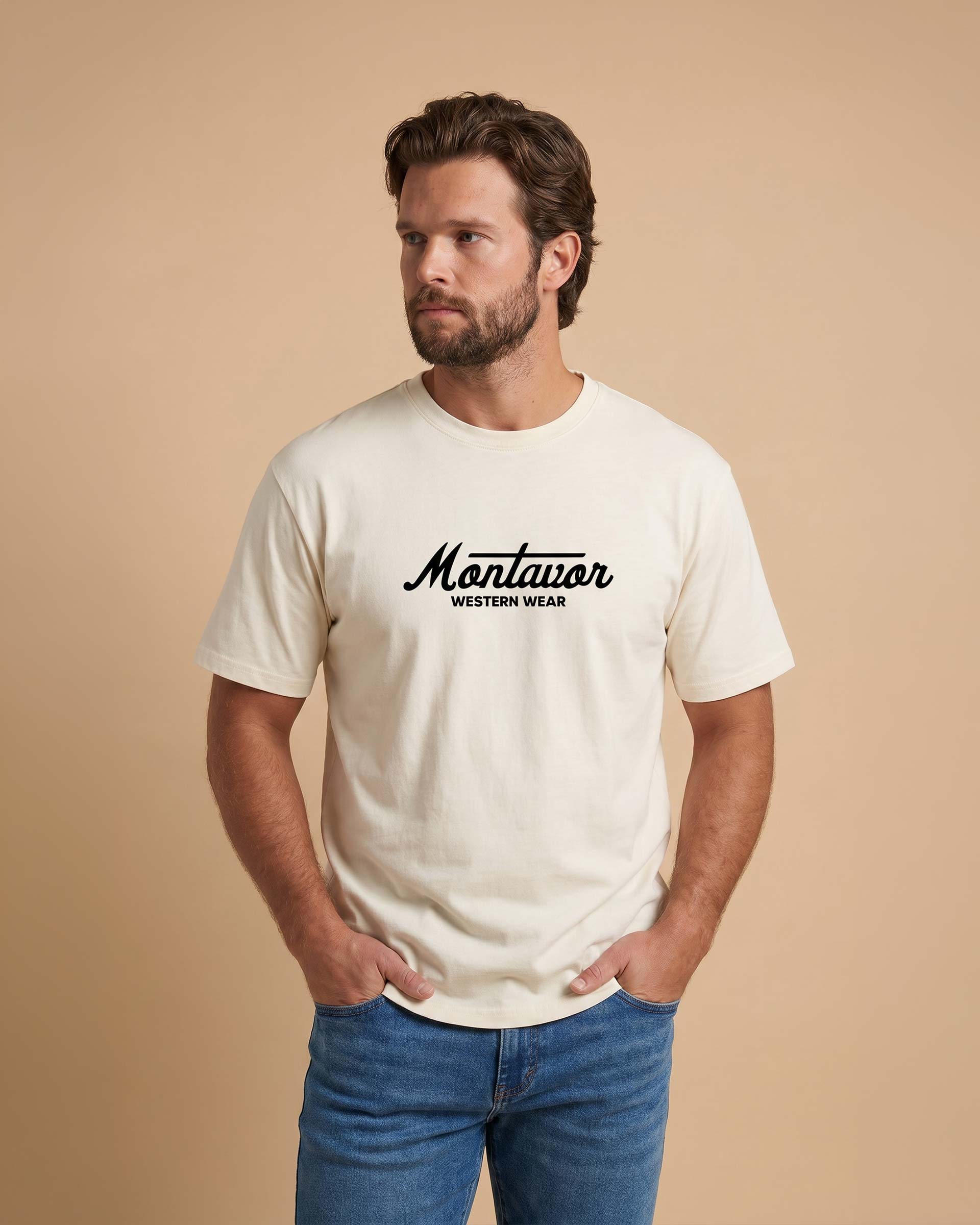 Man wearing a white t-shirt with 'Montavor Western Wear' text on a beige background Main image