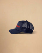 Built For Trouble trucker cap featuring a bold Western-inspired graphic on a high-profile foam-front snapback cap with breathable mesh backing.
