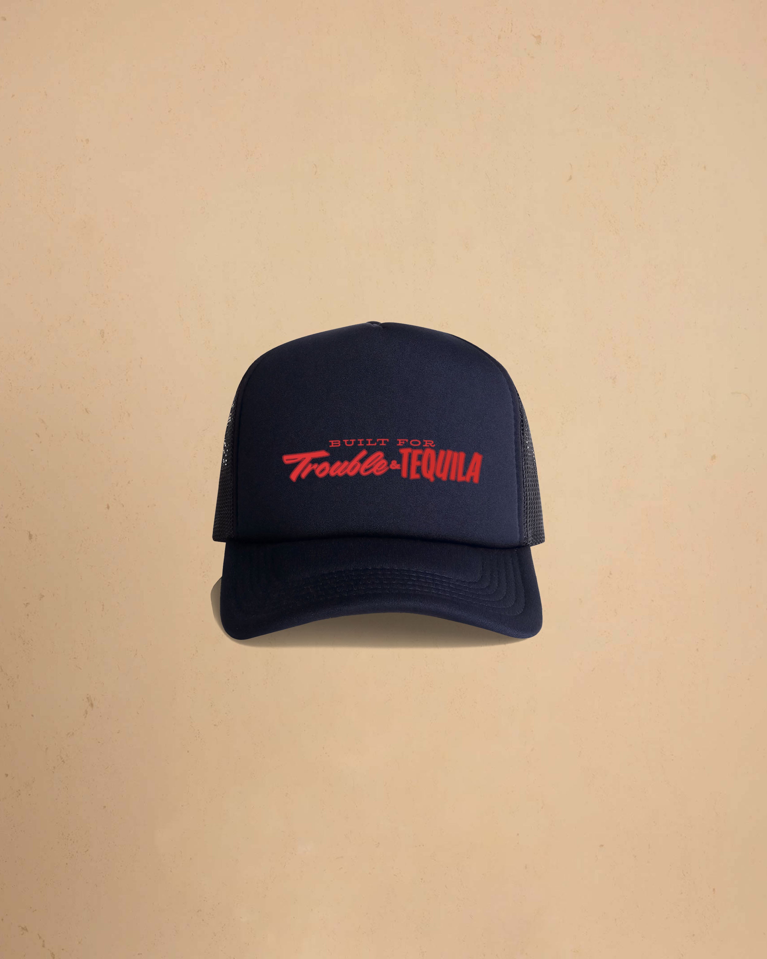 Built For Trouble trucker cap featuring a bold Western-inspired graphic on a high-profile foam-front snapback cap with breathable mesh backing.