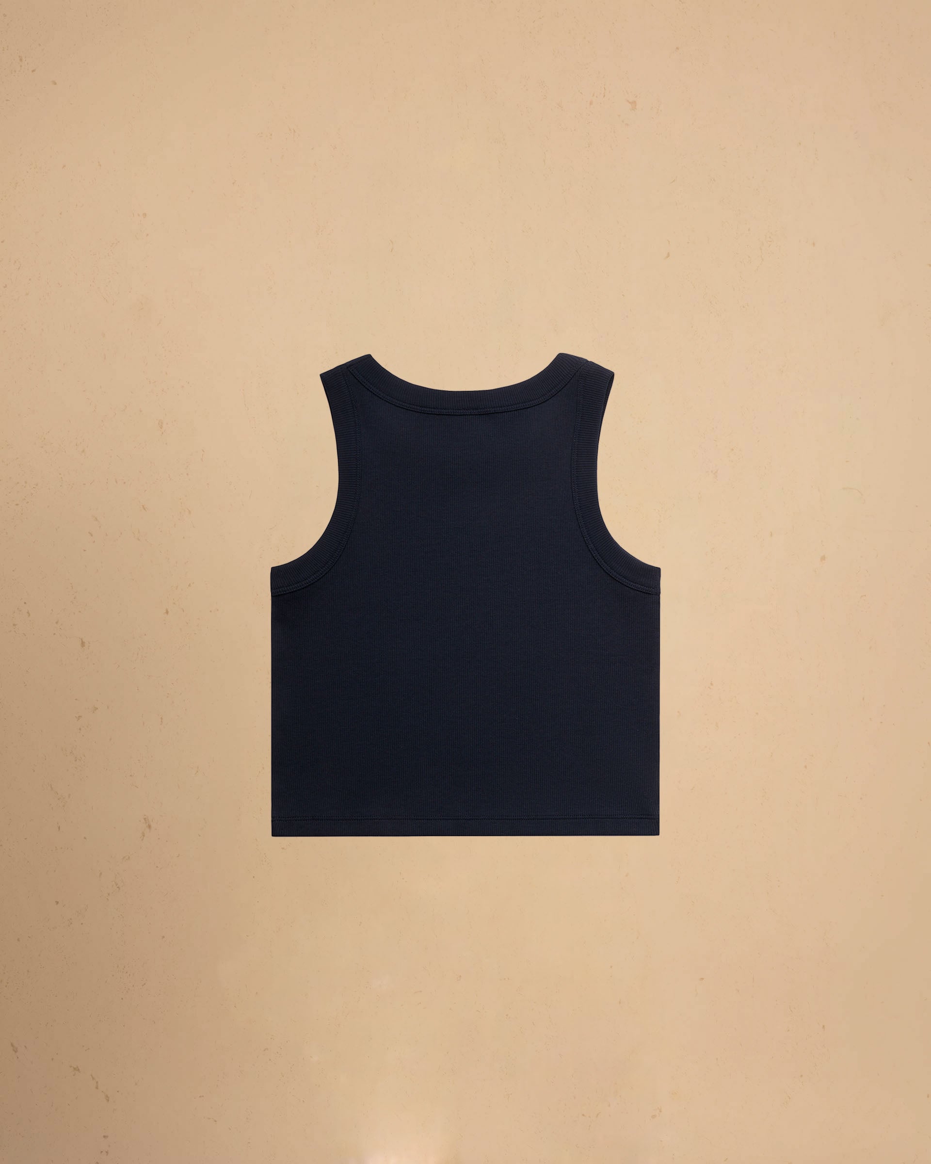 Navy tank top on a beige background