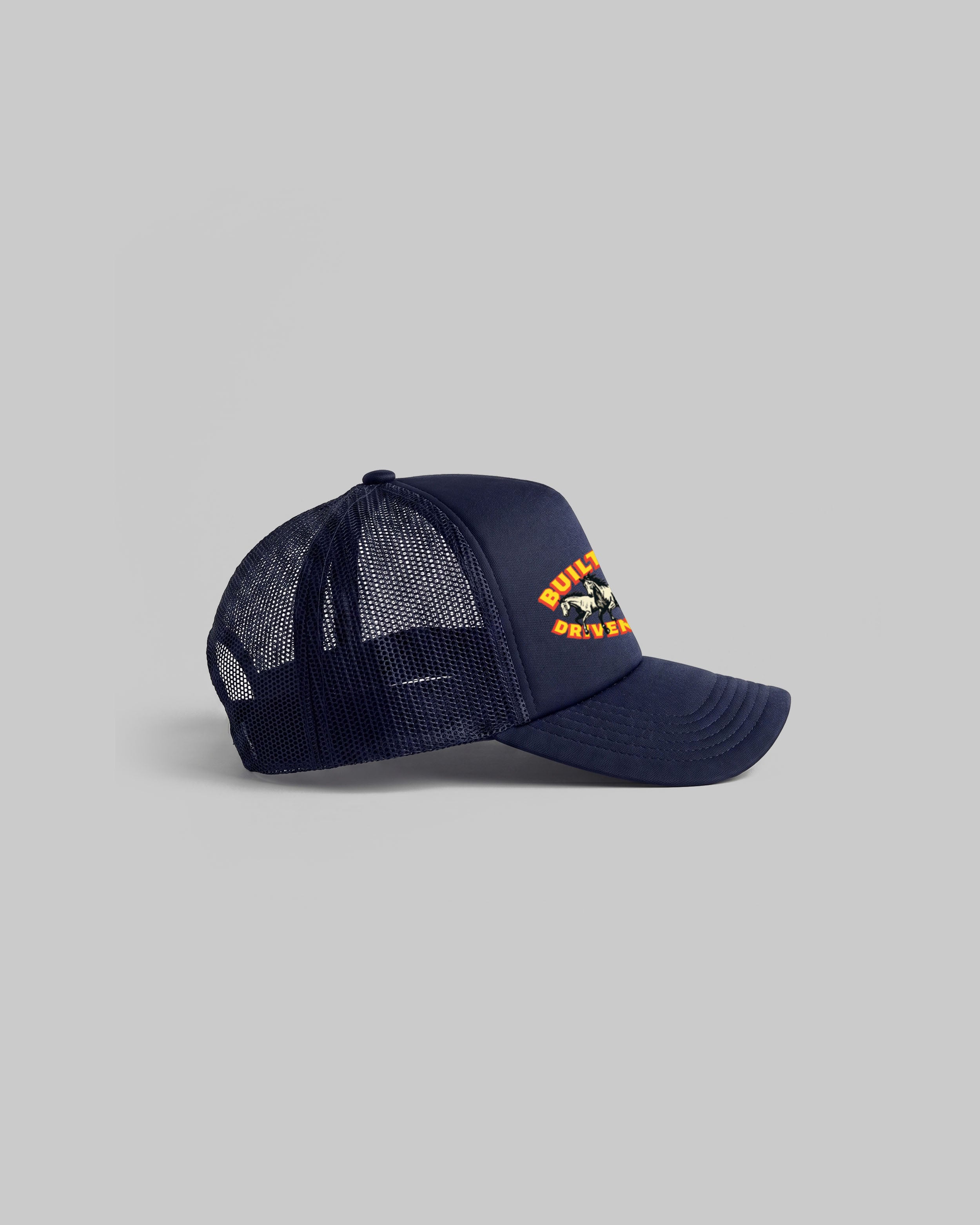 Navy trucker cap with curved peak.