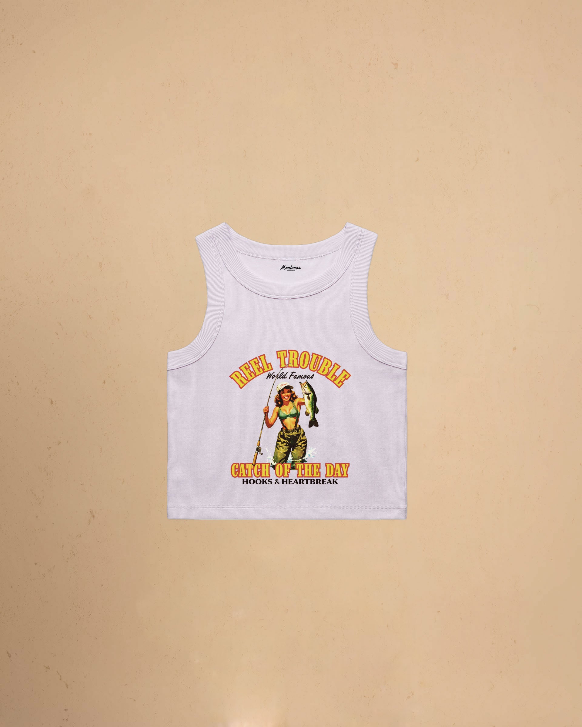 Women’s Reel Trouble organic crop tank featuring a vintage fishing pin-up graphic with retro western styling and heavyweight ribbed cotton construction.
