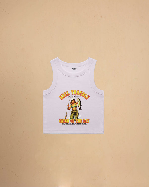 Women’s Reel Trouble organic crop tank featuring a vintage fishing pin-up graphic with retro western styling and heavyweight ribbed cotton construction.