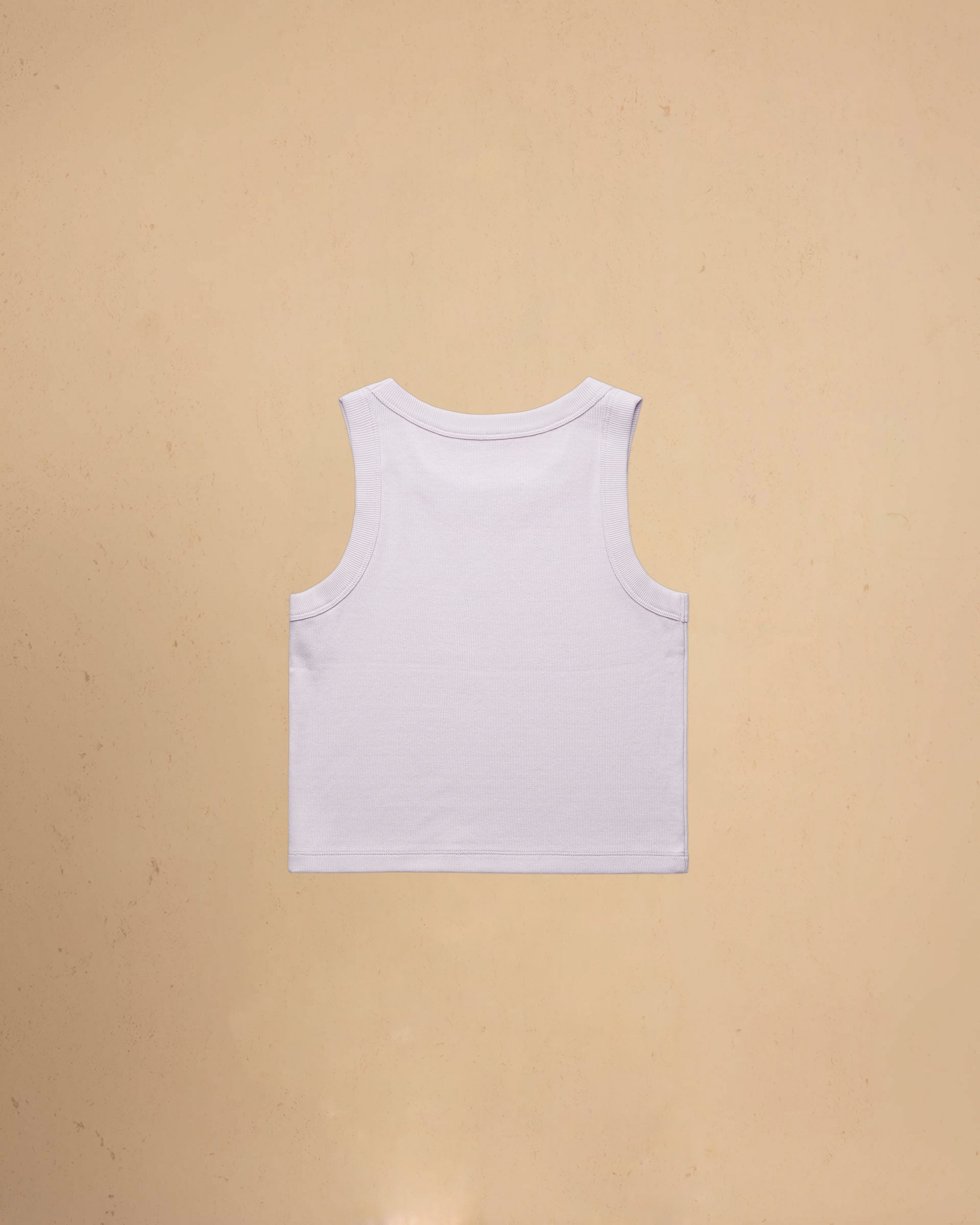 Orchid tank top on a beige background