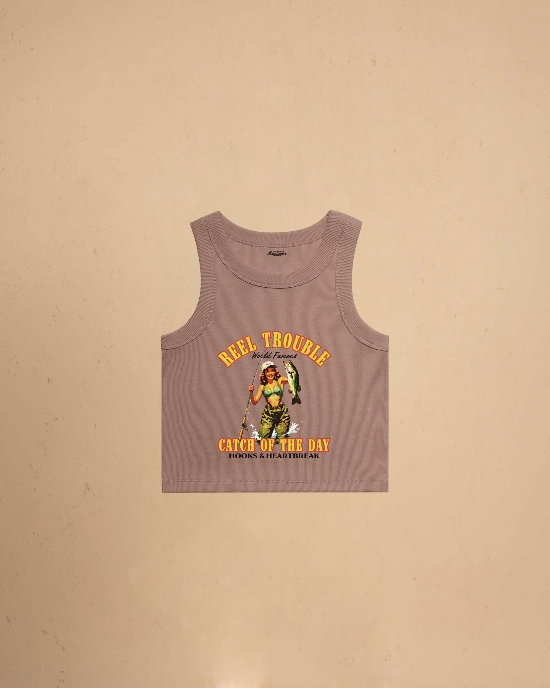 Women’s Reel Trouble organic crop tank featuring a vintage fishing pin-up graphic with retro western styling and heavyweight ribbed cotton construction.