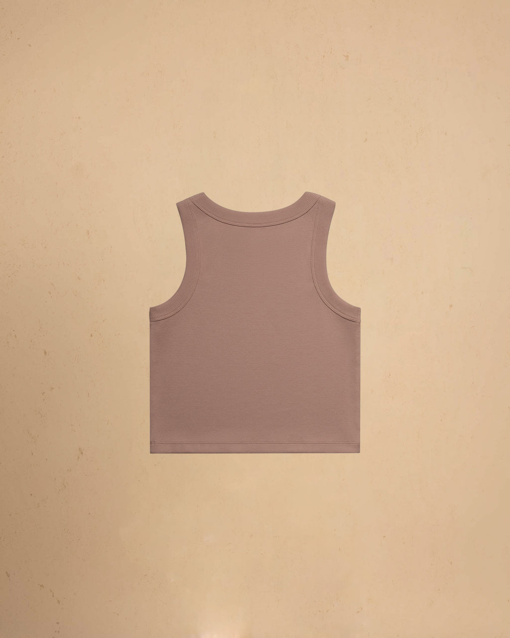 Hazy Pink tank top on a beige background