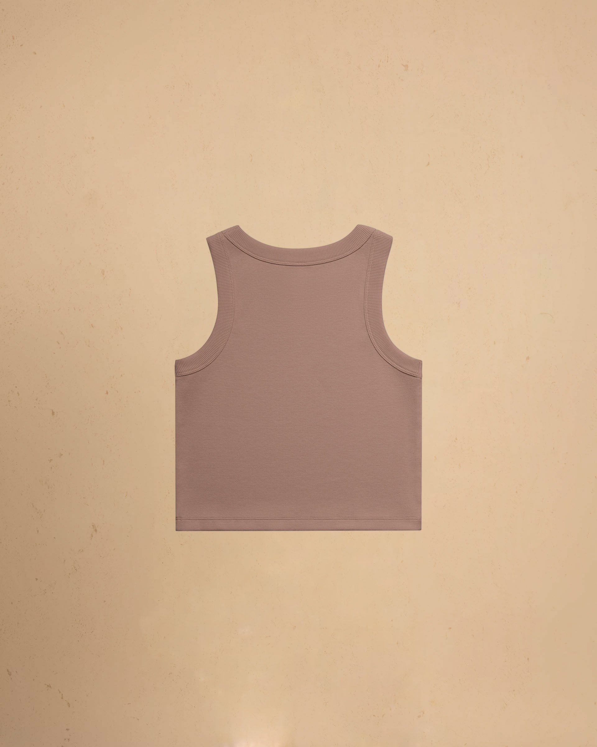 Hazy Pink tank top on a beige background