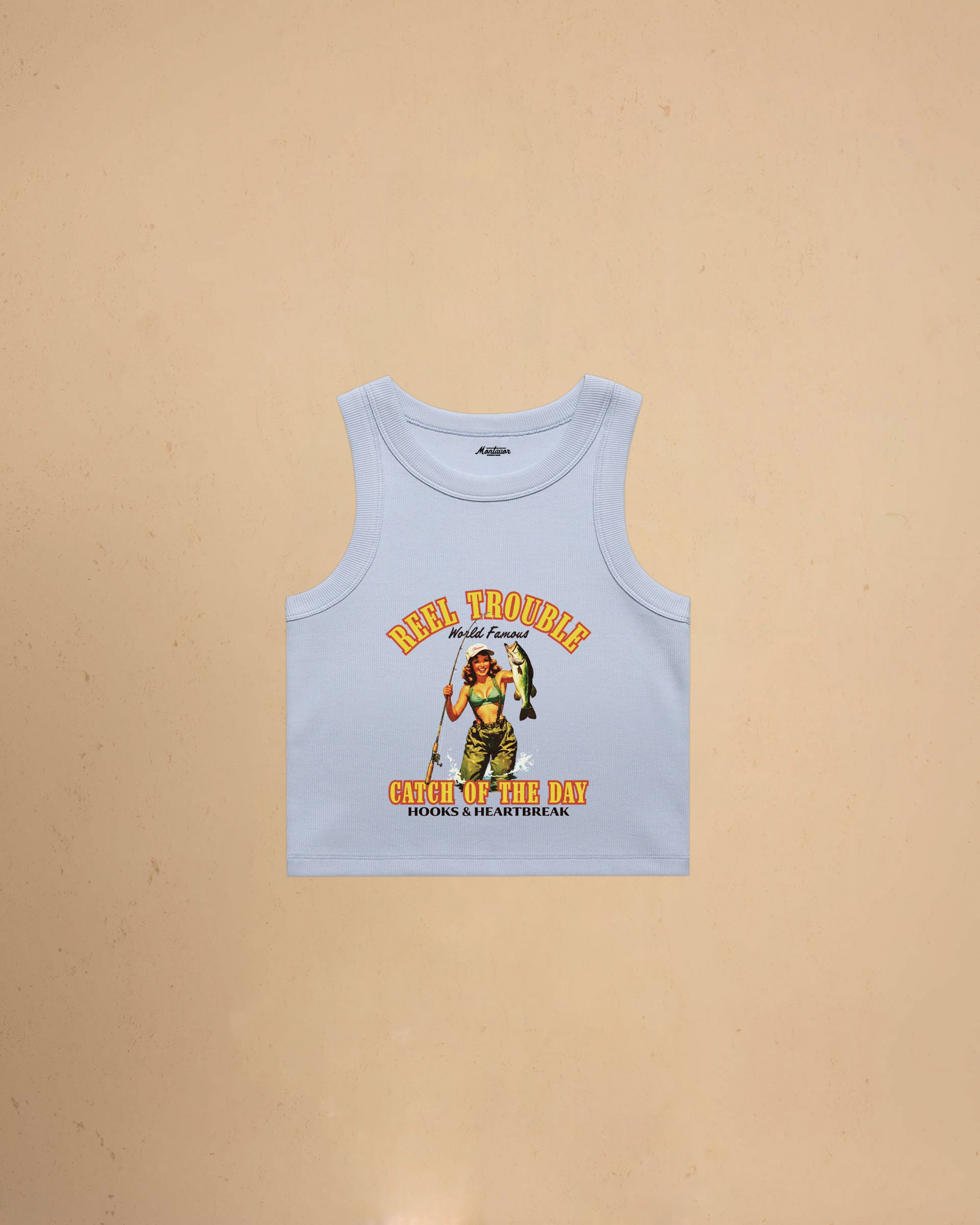 Women’s Reel Trouble organic crop tank featuring a vintage fishing pin-up graphic with retro western styling and heavyweight ribbed cotton construction.