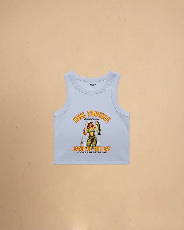 Women’s Reel Trouble organic crop tank featuring a vintage fishing pin-up graphic with retro western styling and heavyweight ribbed cotton construction.