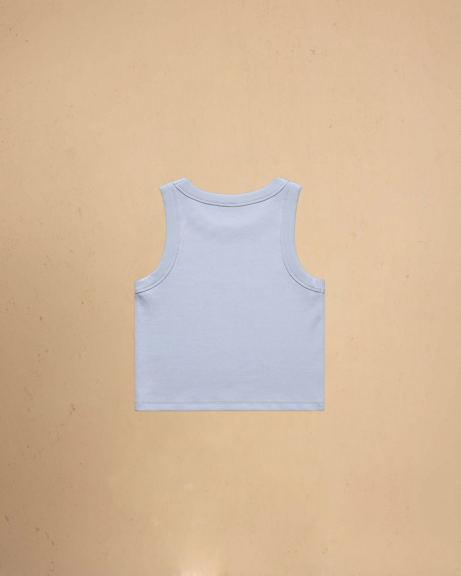 Powder blue tank top on a beige background