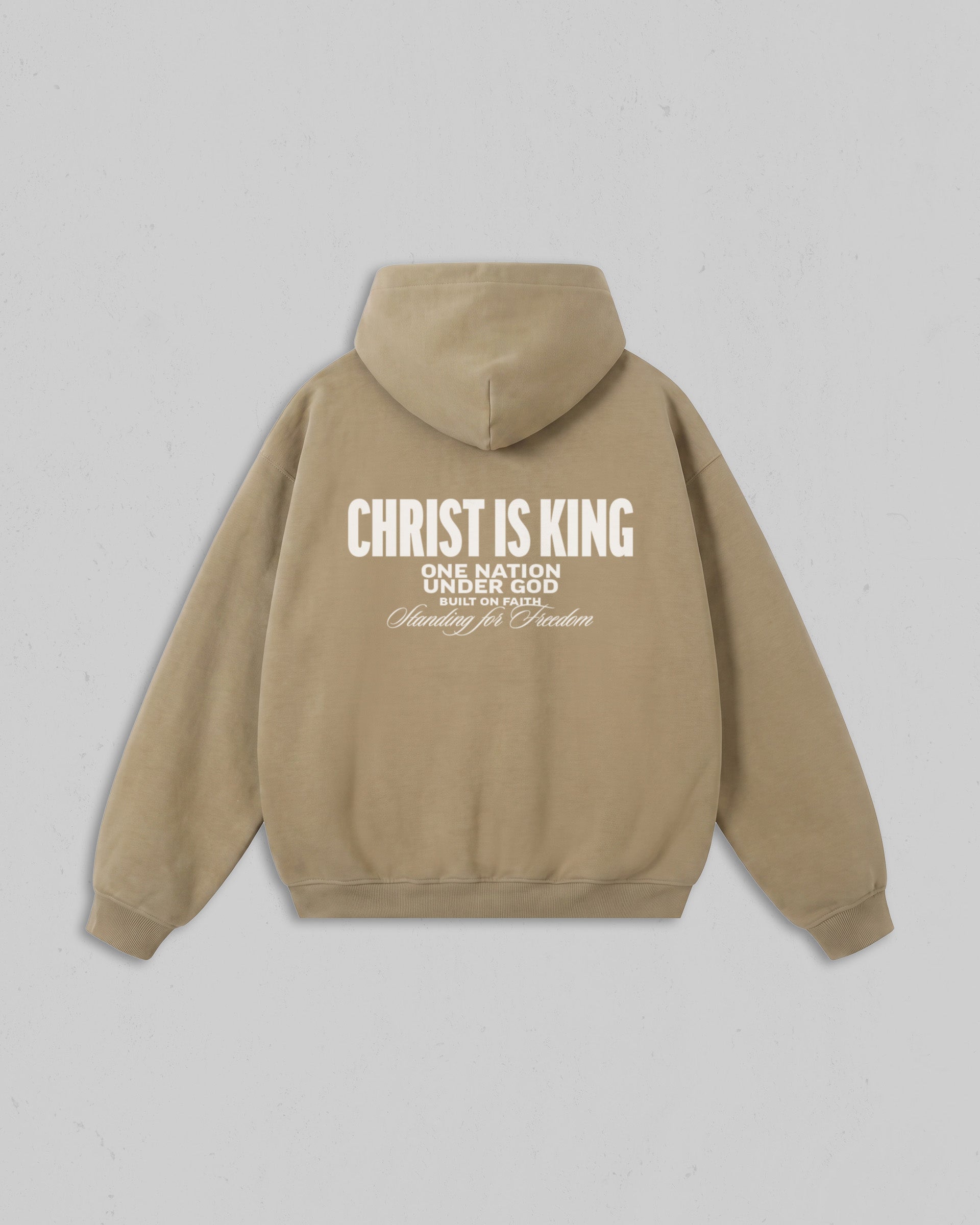 Back view of women’s Beige Christ Is King hoodie with bold white Christian 