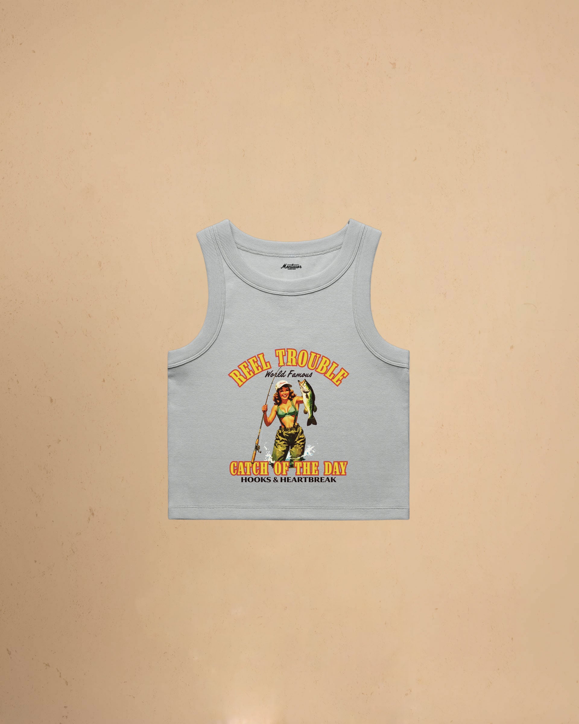 Women’s Reel Trouble organic crop tank featuring a vintage fishing pin-up graphic with retro western styling and heavyweight ribbed cotton construction.