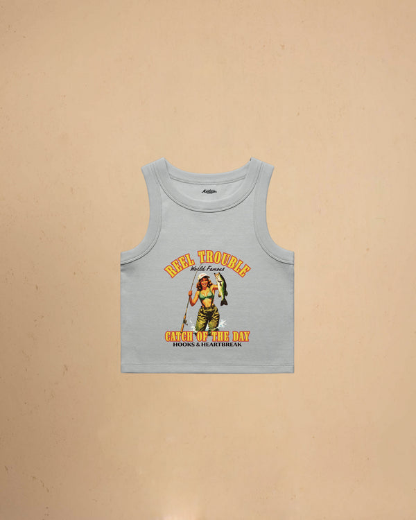 Women’s Reel Trouble organic crop tank featuring a vintage fishing pin-up graphic with retro western styling and heavyweight ribbed cotton construction.