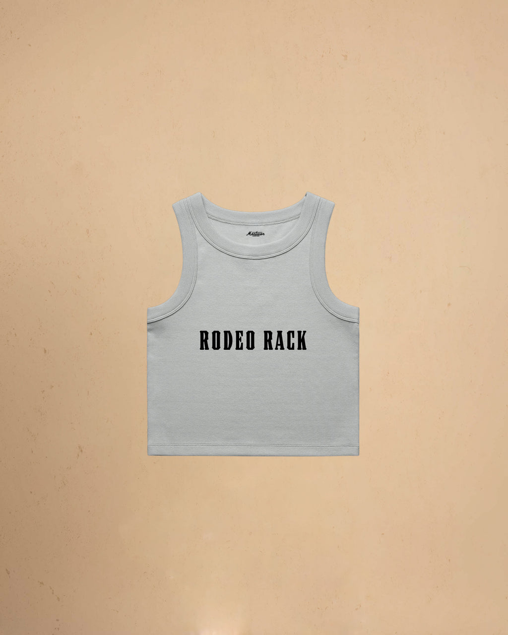Rodeo Rack organic crop tank top by Montavor featuring bold western typography on a premium ribbed cropped tank.