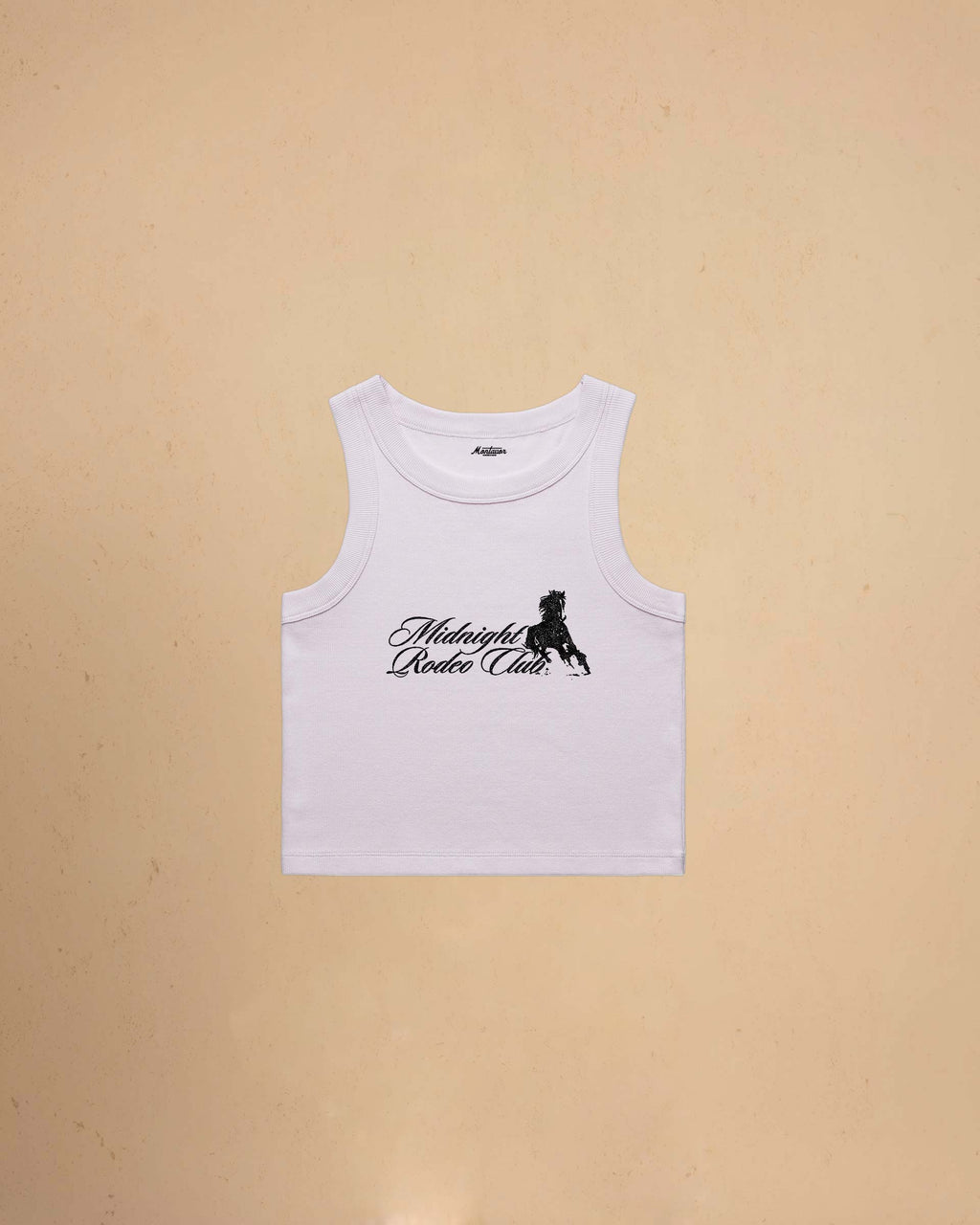 Orchid tank top with Midnight Rodeo Club on a beige background