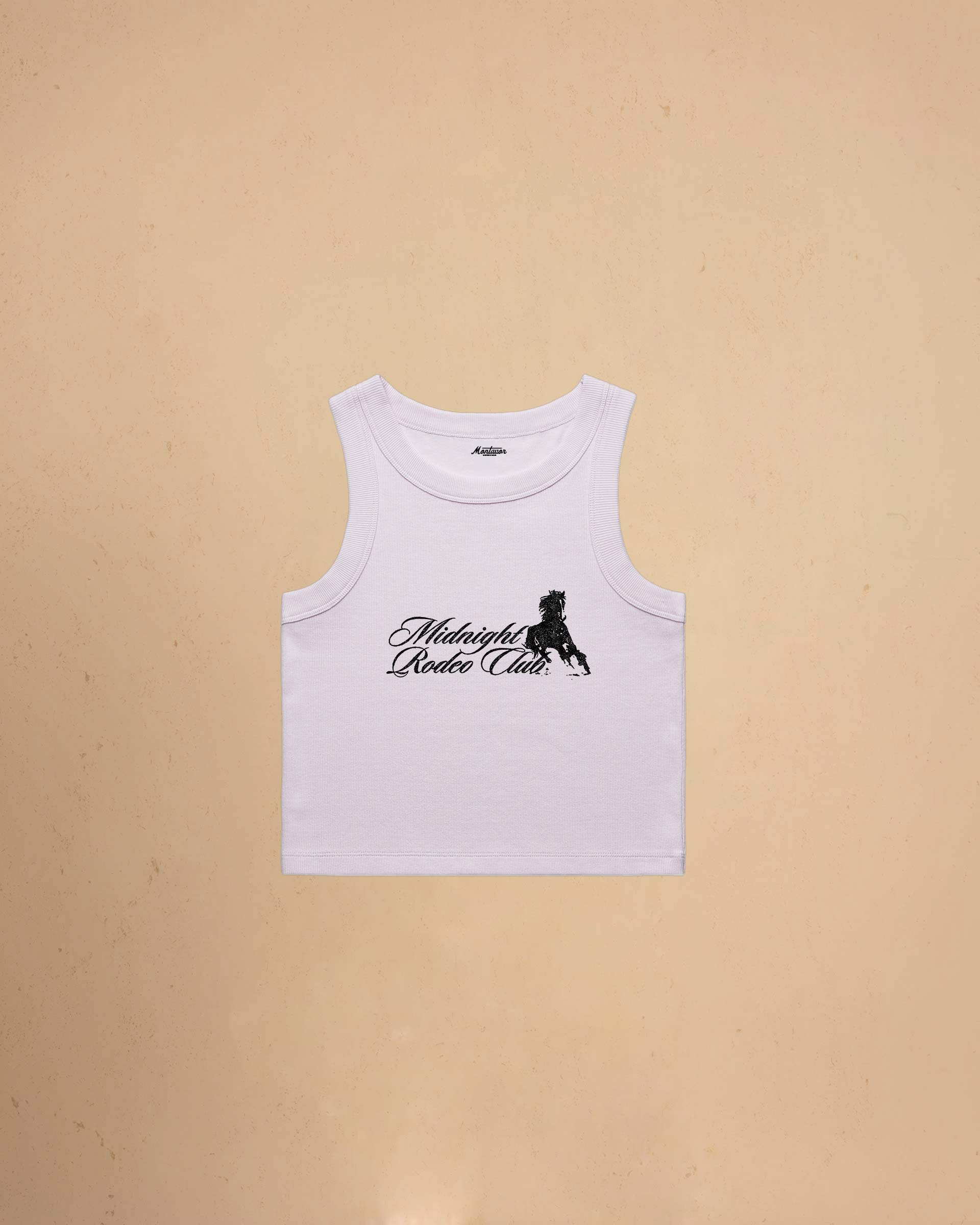 Orchid tank top with Midnight Rodeo Club on a beige background