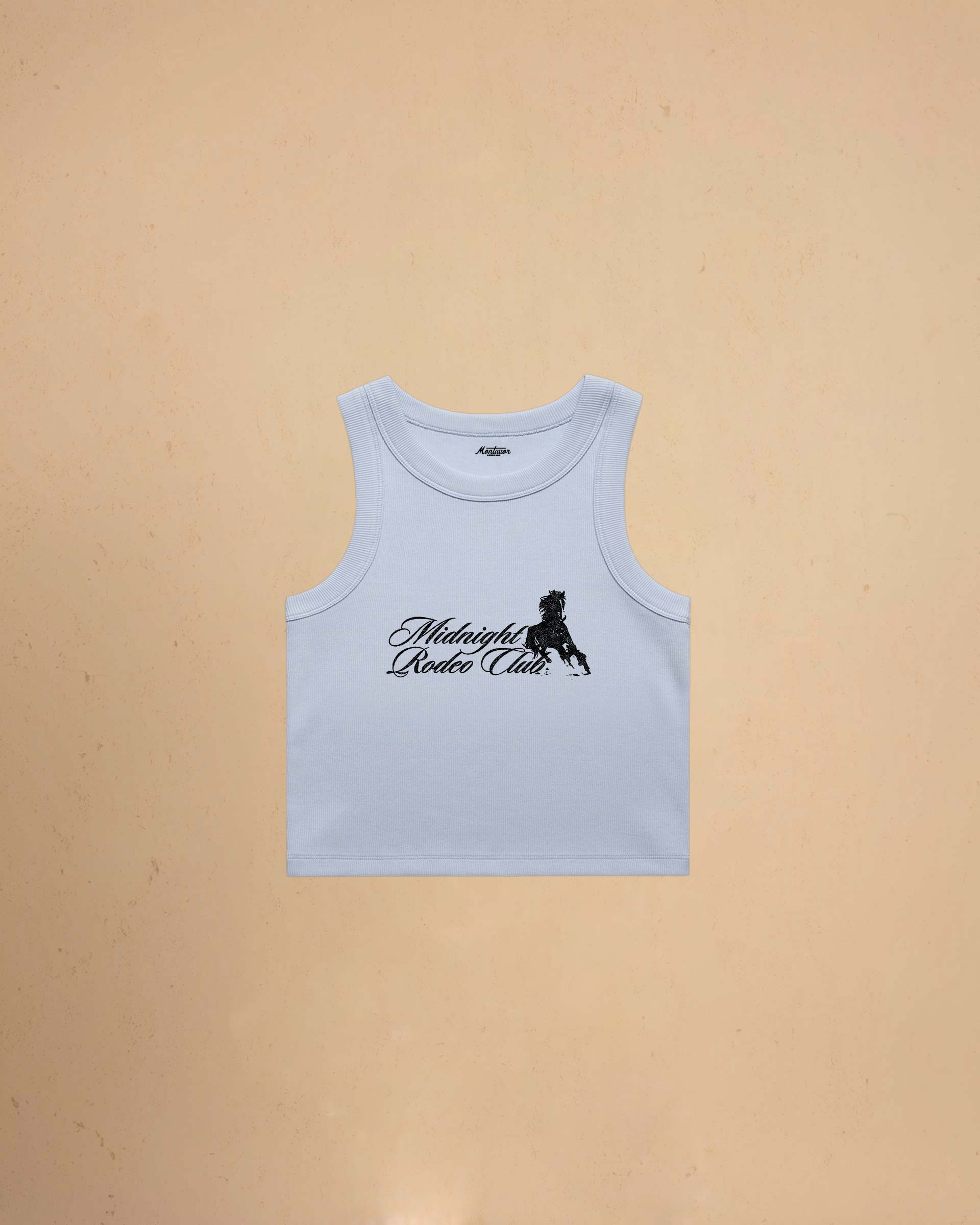 Light blue tank top with Midnight Rodeo Club on a beige background