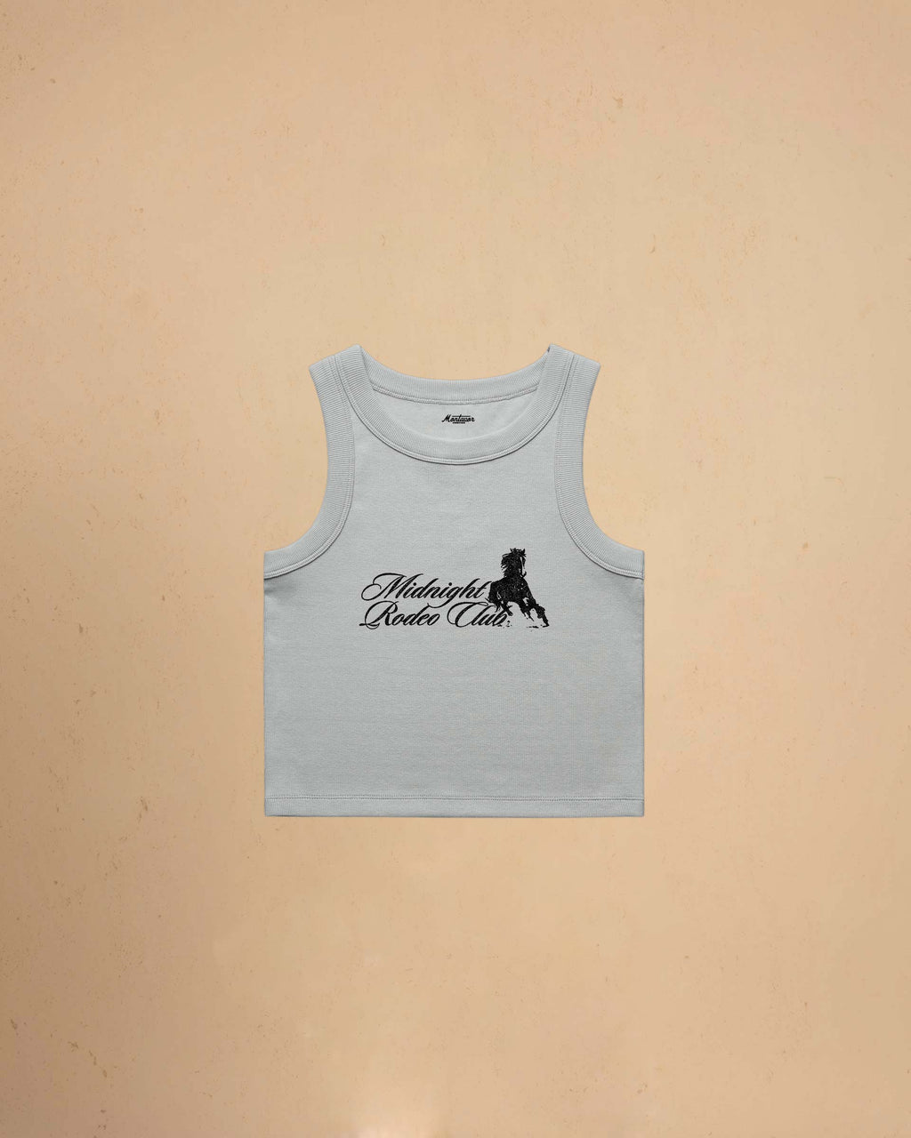 Light blue tank top with Midnight Rodeo Club on a beige background