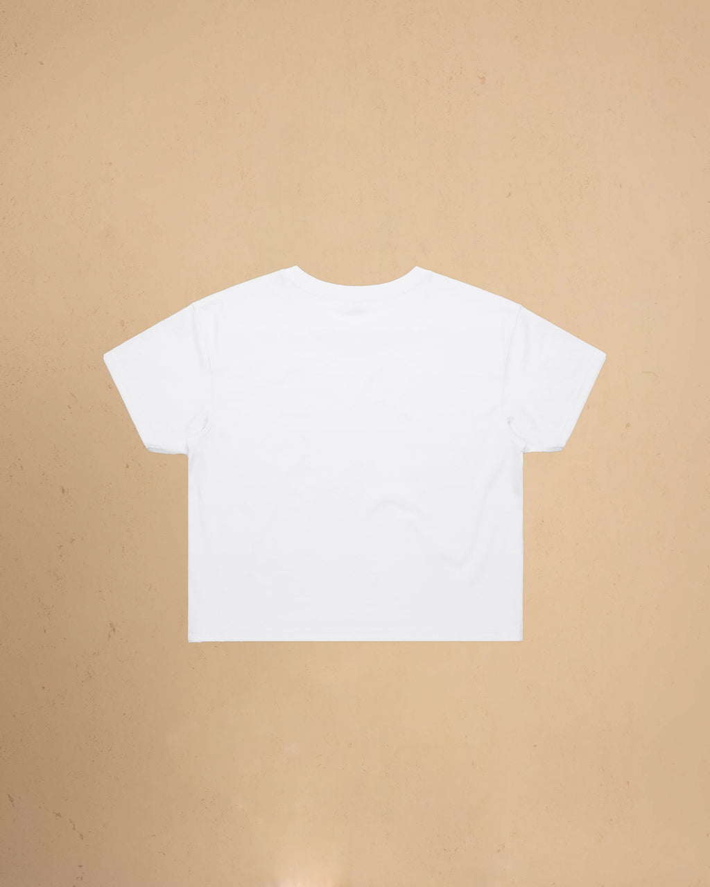 White t-shirt on a beige background