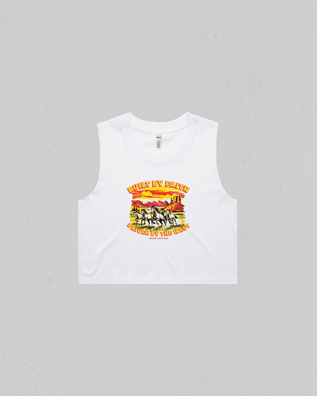 White Women’s “Built By Faith, Driven By The West” crop tank top featuring a vintage western horse and desert graphic by Montavor.