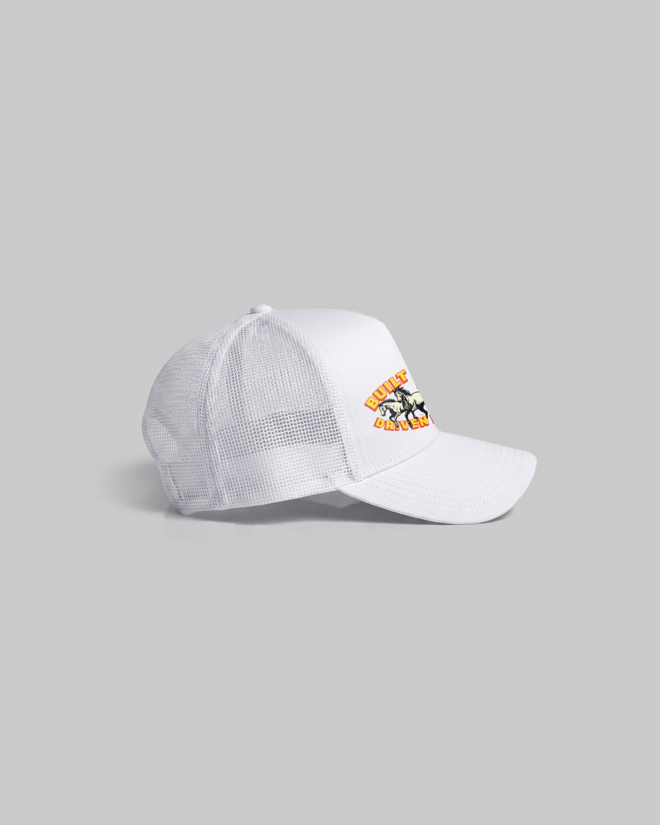 White trucker cap with curved peak.