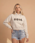 Women’s cropped western hoodie featuring minimalist wild horse artwork on premium fleece fabric by Montavor.