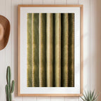 Framed artwork of a cactus on a wall with a hat and plants.