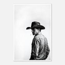 Black and white photograph of a rodeo cowboy wearing a western hat and cigarette, turning toward the camera after competition, western cowboy wall art poster.