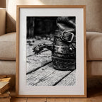Black and white close up of a cowboy boot with metal spur on wooden floor, western ranch wall art.