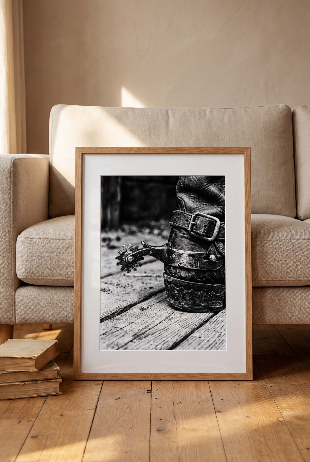 Black and white close up of a cowboy boot with metal spur on wooden floor, western ranch wall art.