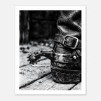 Black and white close up of a cowboy boot with metal spur on wooden floor, western ranch wall art.