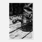 Black and white close up of a cowboy boot with metal spur on wooden floor, western ranch wall art.