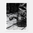 Black and white close up of a cowboy boot with metal spur on wooden floor, western ranch wall art.