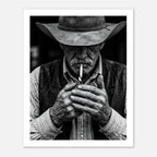 Black and white portrait of a cowboy lighting a cigarette wearing a hat, western wall art.