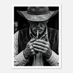 Black and white portrait of a cowboy lighting a cigarette wearing a hat, western wall art.