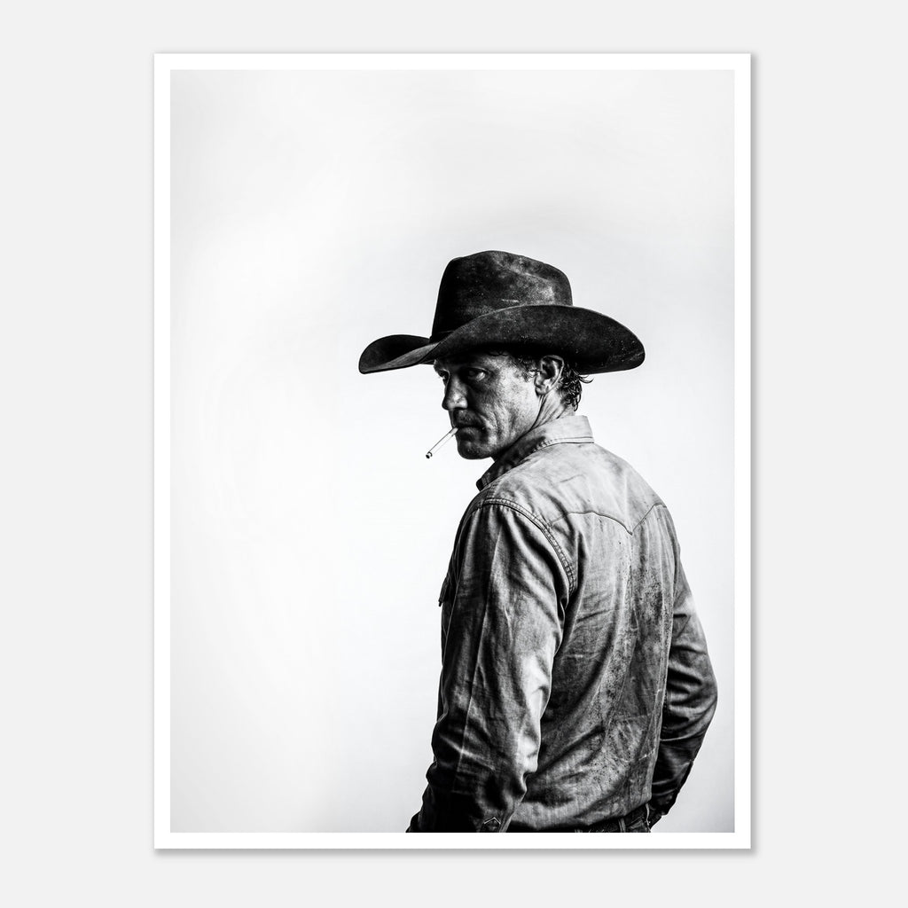 Black and white photograph of a rodeo cowboy wearing a western hat and cigarette, turning toward the camera after competition, western cowboy wall art poster.