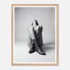 Framed black and white art print of a person wearing cowboy boots on a light gray background.
