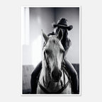 Black and white photograph of a cowgirl riding a horse head on wearing a cowboy hat, western equestrian wall art.