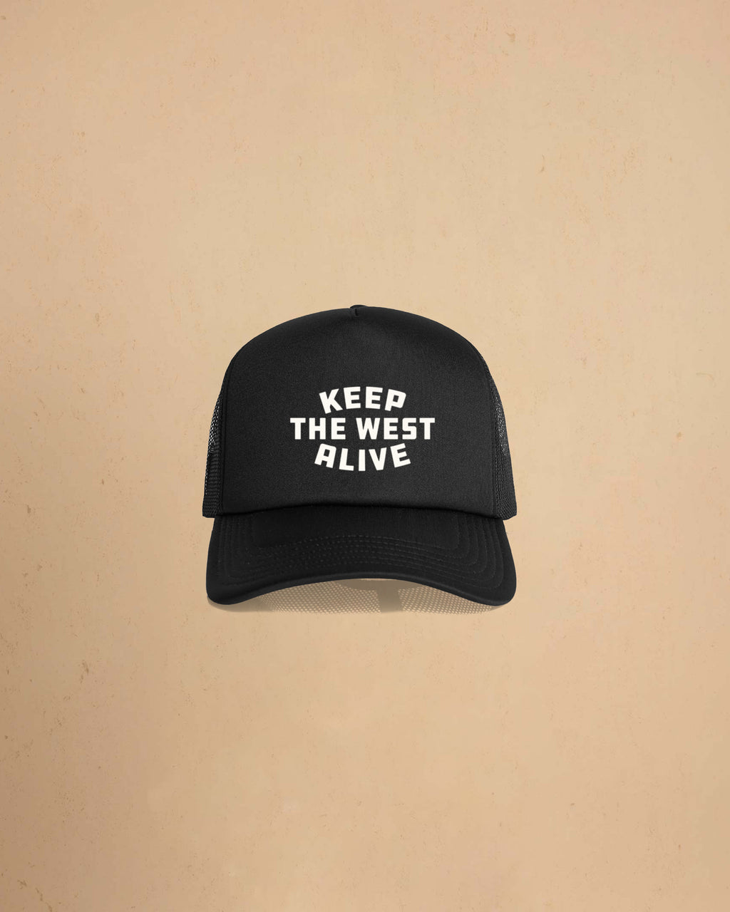 High-profile trucker cap featuring “Keep The West Alive” western typography on the front with mesh back and curved peak.