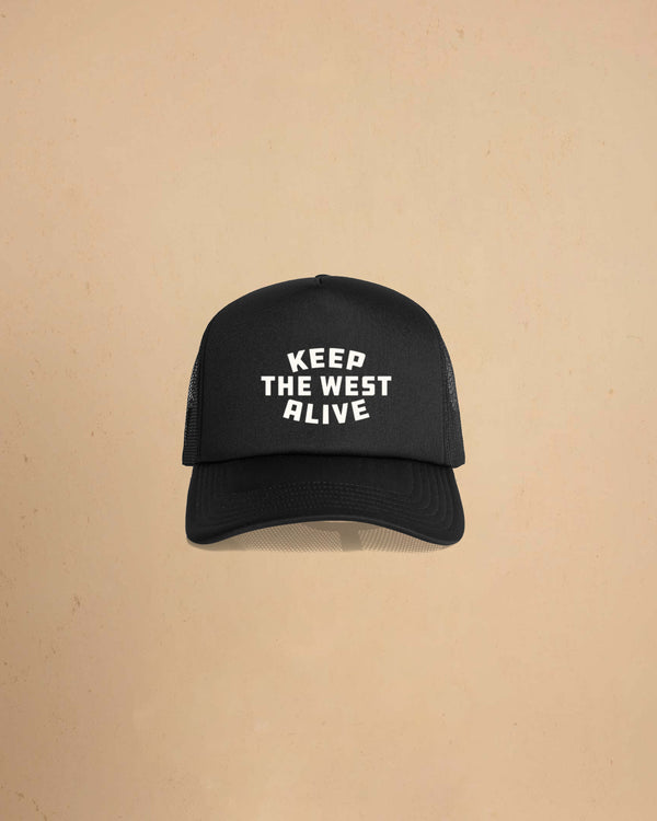 High-profile trucker cap featuring “Keep The West Alive” western typography on the front with mesh back and curved peak.