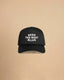 High-profile trucker cap featuring “Keep The West Alive” western typography on the front with mesh back and curved peak.