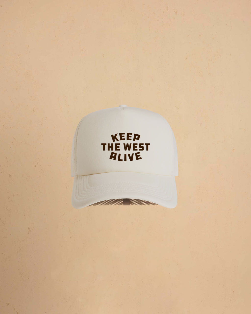 High-profile trucker cap featuring “Keep The West Alive” western typography on the front with mesh back and curved peak.