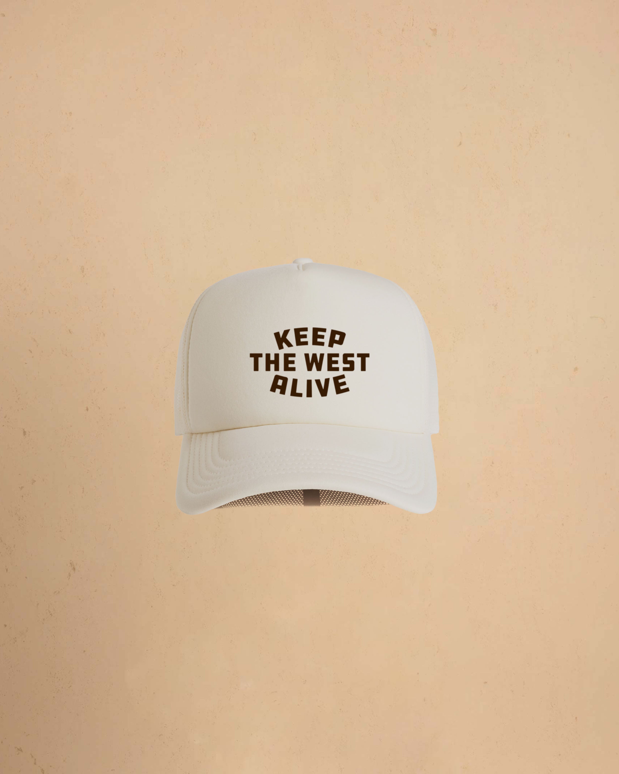 High-profile trucker cap featuring “Keep The West Alive” western typography on the front with mesh back and curved peak.