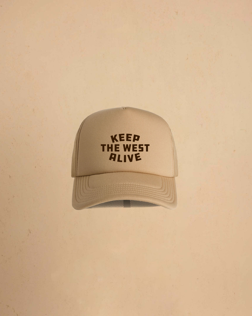 High-profile trucker cap featuring “Keep The West Alive” western typography on the front with mesh back and curved peak.