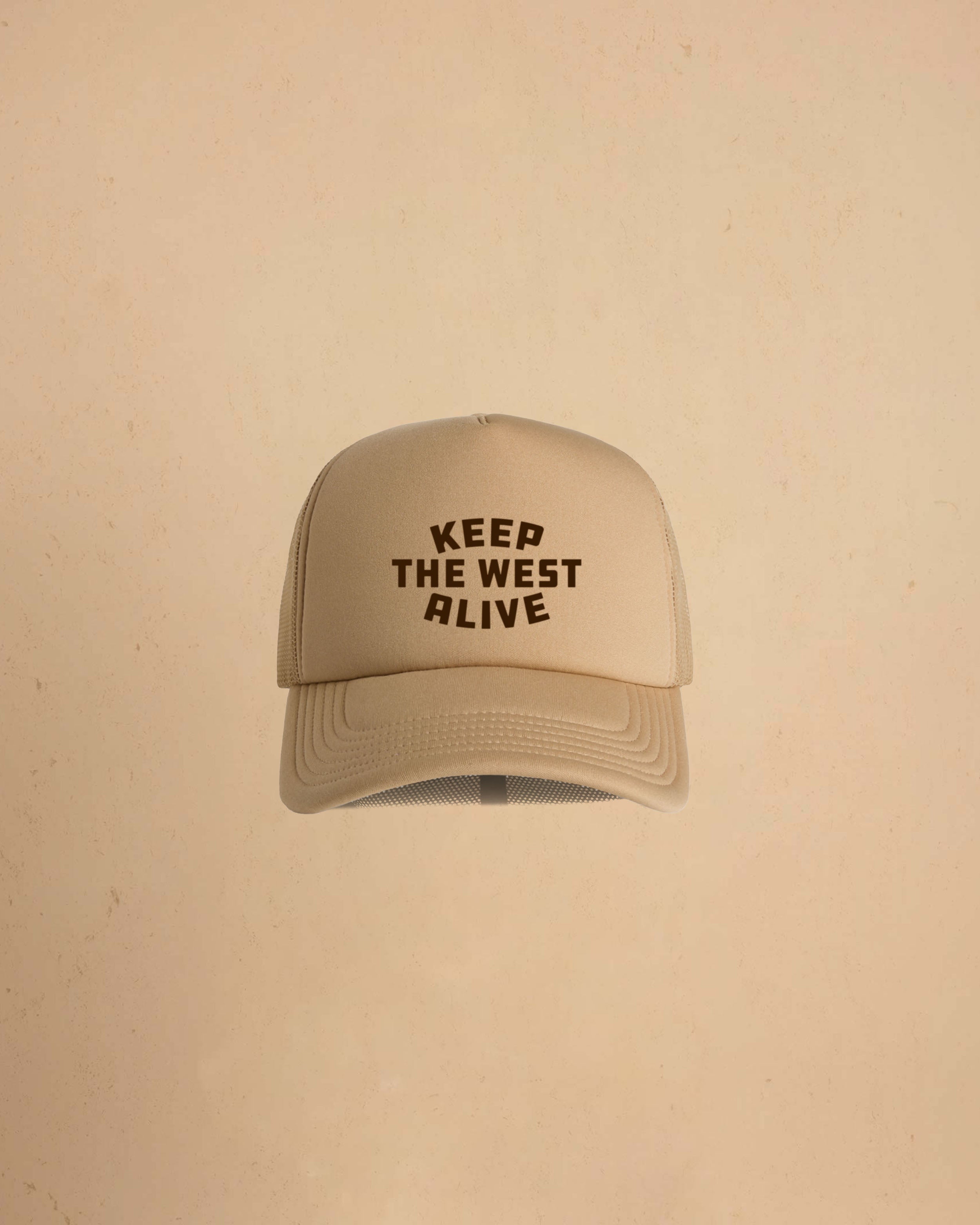 High-profile trucker cap featuring “Keep The West Alive” western typography on the front with mesh back and curved peak.