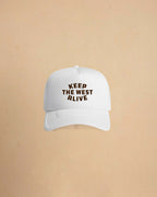 High-profile trucker cap featuring “Keep The West Alive” western typography on the front with mesh back and curved peak.