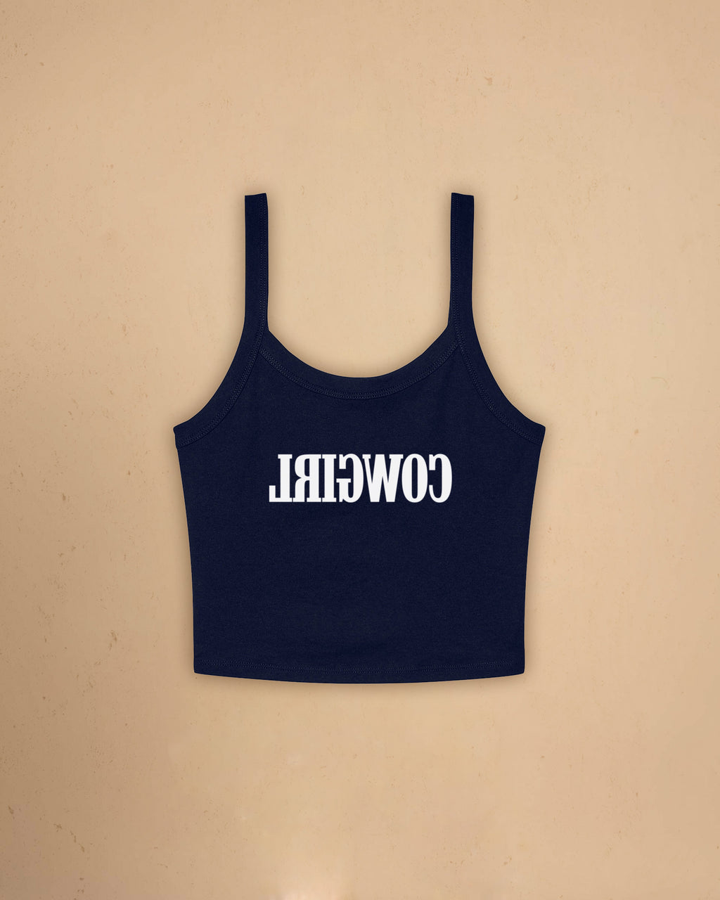 Fitted western-inspired strap tank top featuring mirrored “Cowgirl” typography on the front with a soft micro rib silhouette.