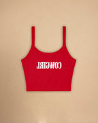 Fitted western-inspired strap tank top featuring mirrored “Cowgirl” typography on the front with a soft micro rib silhouette.