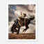 Cowboy riding a bucking horse at sunset with dust and dramatic sky, western rodeo wall art print