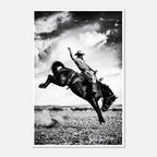 Black and white rodeo wall art showing a cowboy riding a bucking horse in motion.